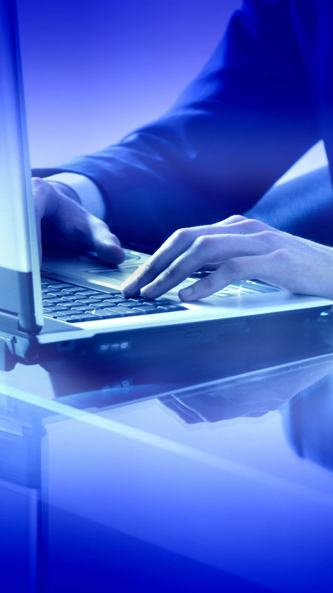 Typing On Laptop Blue Light Android Wallpaper